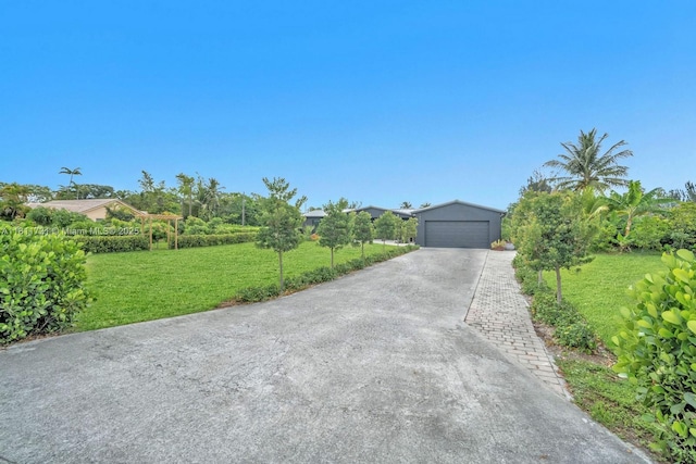 13711 SW 29th St, Davie, FL 33330 - view of front of house with a detached garage and a front yard