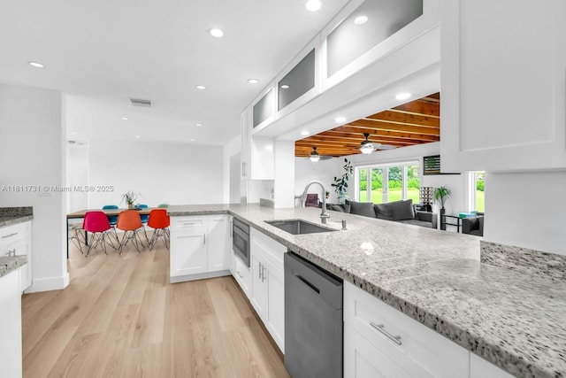 13711 SW 29th St, Davie, FL 33330 - kitchen featuring stainless steel appliances, a sink, ceiling fan, white cabinetry, and light wood-style floors