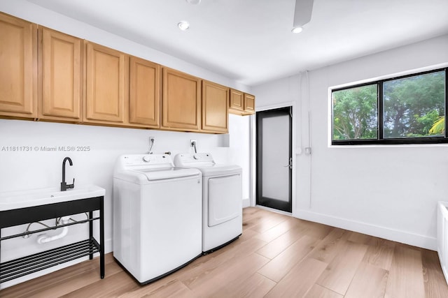 13711 SW 29th St, Davie, FL 33330 - washroom featuring washer and dryer, cabinet space, light wood-style flooring, recessed lighting, and baseboards