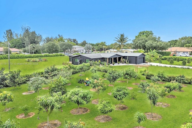 13711 SW 29th St, Davie, FL 33330 - back of property with view of wooded area and a yard