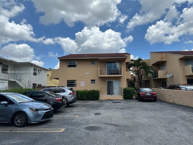 1241 NW 6th St Unit 2, Miami, FL 33125 - view of property featuring uncovered parking