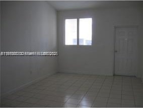 1666 SE 27th Ct Unit 205, Homestead, FL 33035 - view of tiled empty room
