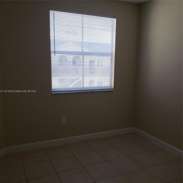 1666 SE 27th Ct Unit 205, Homestead, FL 33035 - tiled spare room with baseboards