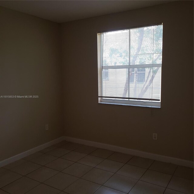 1666 SE 27th Ct Unit 205, Homestead, FL 33035 - empty room featuring baseboards and light tile patterned flooring