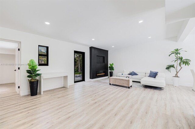 3105 SW 16th St, Fort Lauderdale, FL 33312 - living area with light wood-style floors, recessed lighting, a fireplace, and baseboards