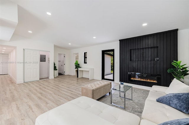 3105 SW 16th St, Fort Lauderdale, FL 33312 - living room featuring wood finished floors, recessed lighting, baseboards, a large fireplace, and electric panel