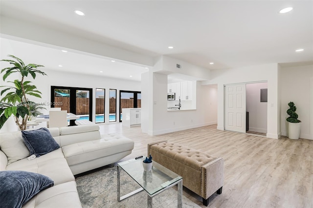 3105 SW 16th St, Fort Lauderdale, FL 33312 - living room featuring light wood-type flooring, recessed lighting, and baseboards