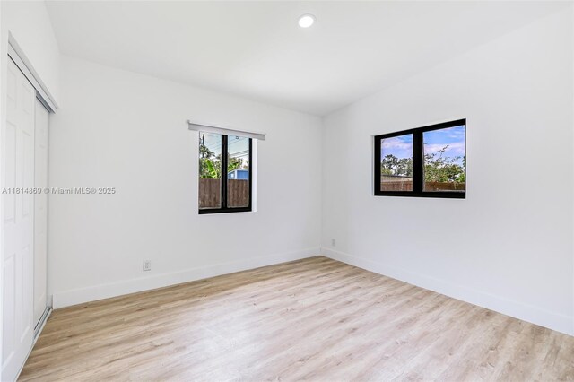 3105 SW 16th St, Fort Lauderdale, FL 33312 - unfurnished bedroom featuring wood finished floors, baseboards, a closet, and recessed lighting