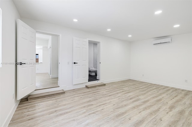 3105 SW 16th St, Fort Lauderdale, FL 33312 - unfurnished room with an AC wall unit, light wood-style flooring, recessed lighting, and baseboards