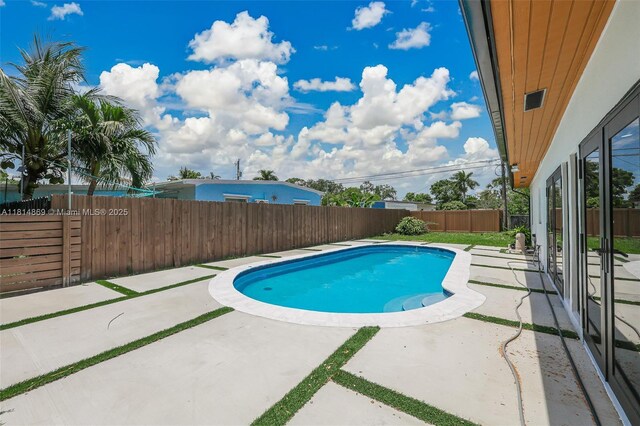 3105 SW 16th St, Fort Lauderdale, FL 33312 - view of swimming pool featuring a patio and a fenced backyard