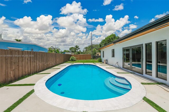 3105 SW 16th St, Fort Lauderdale, FL 33312 - view of swimming pool with a fenced backyard and a patio area
