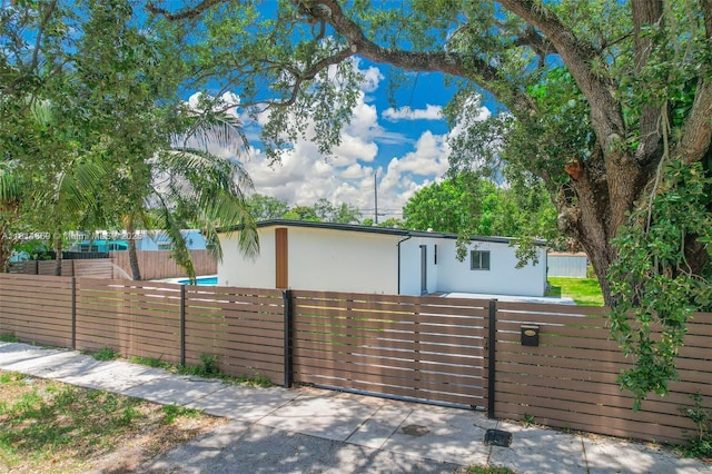 3105 SW 16th St, Fort Lauderdale, FL 33312 - view of front of property with a fenced front yard and stucco siding