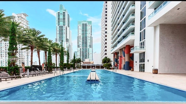50 Biscayne Blvd Unit 3303, Miami, FL 33132 - community pool with a patio and a skyline view
