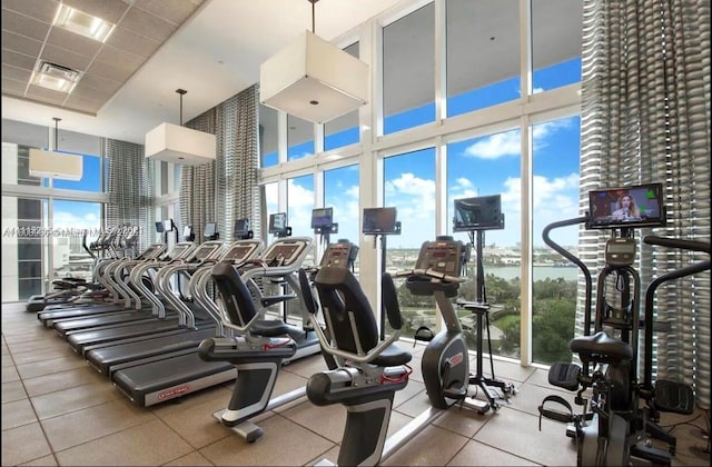 50 Biscayne Blvd Unit 3303, Miami, FL 33132 - gym featuring a wall of windows and a high ceiling