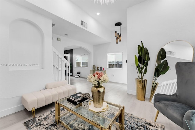 22618 SW 94th Path, Cutler Bay, FL 33190 - living room with arched walkways, wood finished floors, a chandelier, baseboards, and recessed lighting