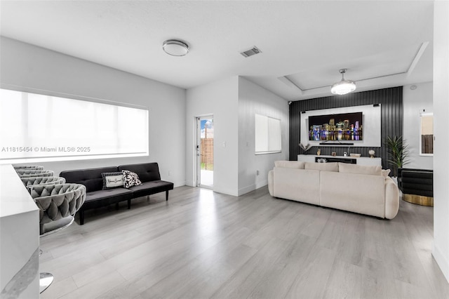 22618 SW 94th Path, Cutler Bay, FL 33190 - living area featuring wood finished floors, baseboards, and a raised ceiling
