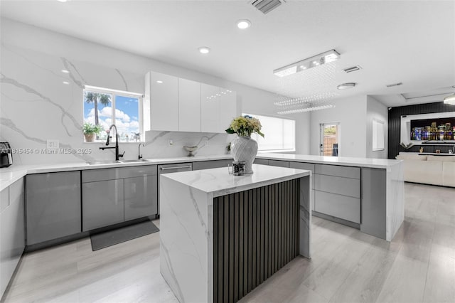 22618 SW 94th Path, Cutler Bay, FL 33190 - kitchen with modern cabinets, a sink, gray cabinetry, a center island, and healthy amount of natural light