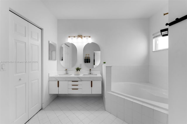 22618 SW 94th Path, Cutler Bay, FL 33190 - bathroom with a garden tub, double vanity, tile patterned flooring, and a closet