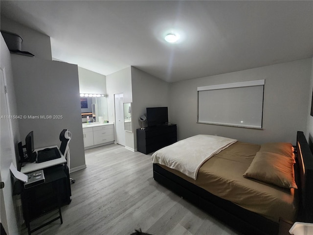 10875 NW 8th St, Pembroke Pines, FL 33026 - bedroom featuring light wood-style floors, vaulted ceiling, and ensuite bathroom