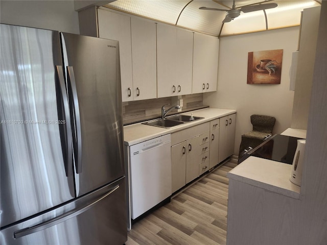 4144 Cambridge G 4144, Deerfield Beach, FL 33442 - kitchen with freestanding refrigerator, white dishwasher, ceiling fan, light countertops, and a sink
