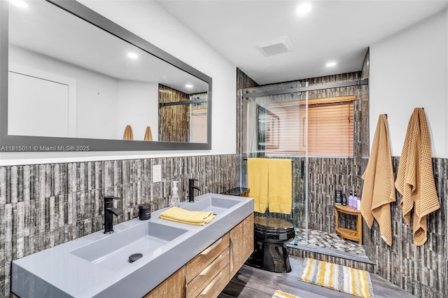 3145 Day Ave Unit 1, Miami, FL 33133 - full bath with a stall shower, toilet, double vanity, recessed lighting, and wood finished floors