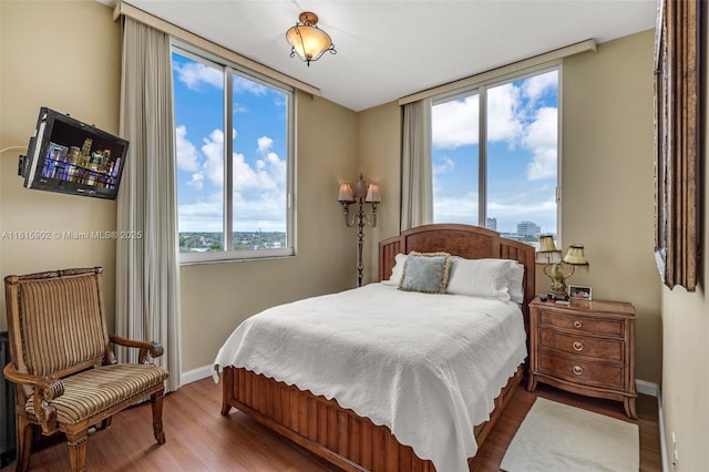 2775 NE 187th St Unit Ph6, Aventura, FL 33180 - bedroom featuring baseboards and wood finished floors