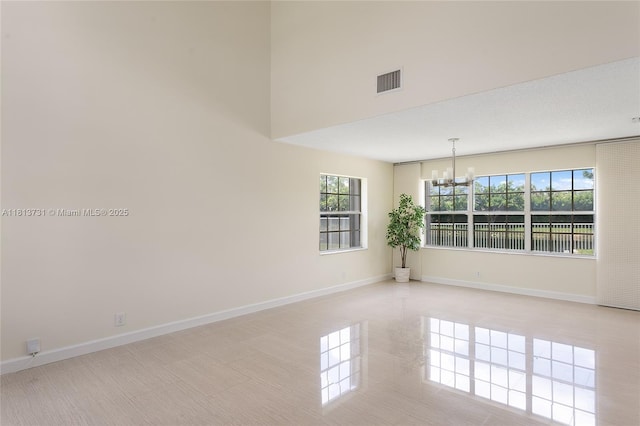 210 Somerset Way, Weston, FL 33326 - spare room featuring a chandelier and baseboards