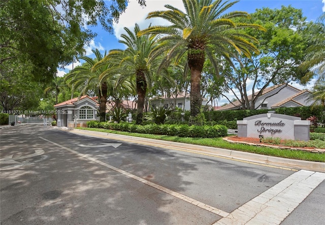 210 Somerset Way, Weston, FL 33326 - view of asphalt road with a gated entry and curbs