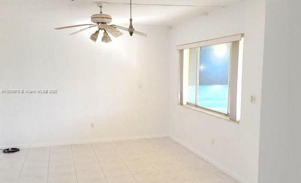 2101 NE 68th St Unit 202, Fort Lauderdale, FL 33308 - spare room with a ceiling fan and baseboards