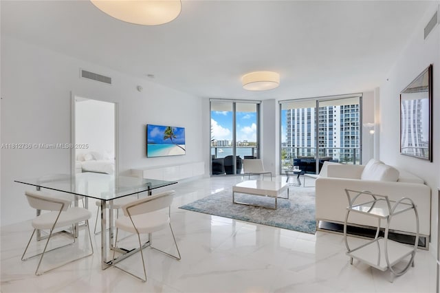 17301 Biscayne Blvd Unit 605, North Miami Beach, FL 33160 - living room featuring expansive windows