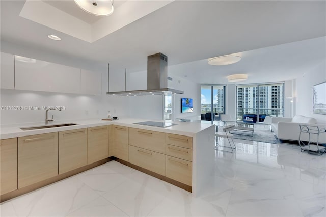 17301 Biscayne Blvd Unit 605, North Miami Beach, FL 33160 - kitchen featuring island exhaust hood, light brown cabinetry, a sink, open floor plan, and modern cabinets
