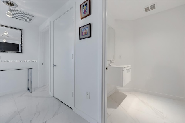 17301 Biscayne Blvd Unit 605, North Miami Beach, FL 33160 - bathroom featuring vanity and marble finish flooring