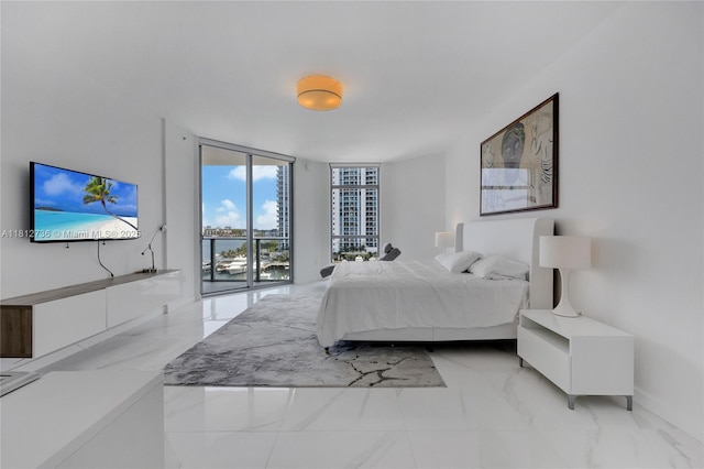17301 Biscayne Blvd Unit 605, North Miami Beach, FL 33160 - bedroom featuring floor to ceiling windows, access to outside, light marble finish floors, and baseboards