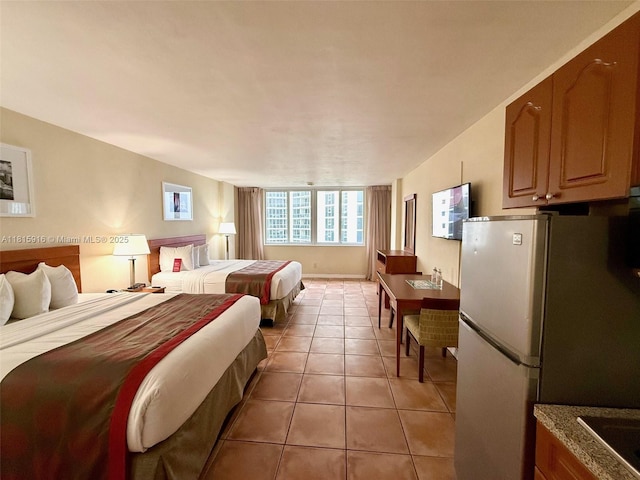 19201 Collins Ave Unit 1019, Sunny Isles Beach, FL 33160 - bedroom with freestanding refrigerator and light tile patterned floors