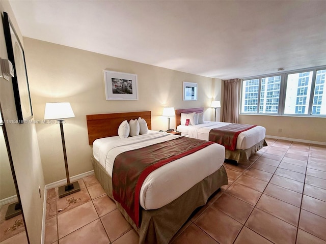 19201 Collins Ave Unit 1019, Sunny Isles Beach, FL 33160 - bedroom with baseboards and light tile patterned floors