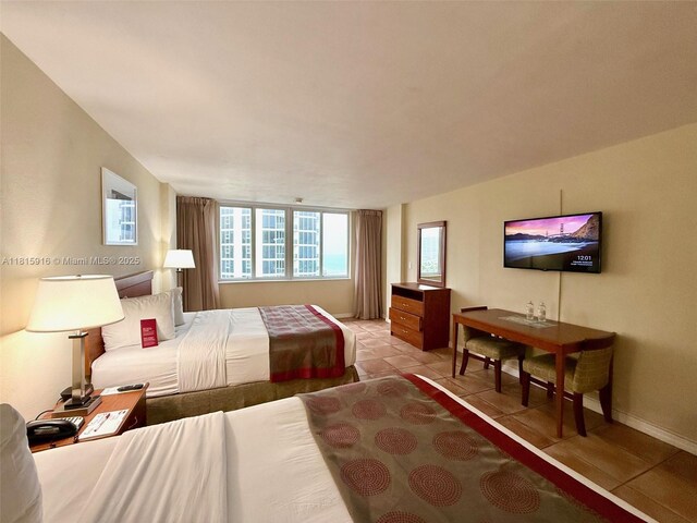 19201 Collins Ave Unit 1019, Sunny Isles Beach, FL 33160 - bedroom with light tile patterned flooring and baseboards