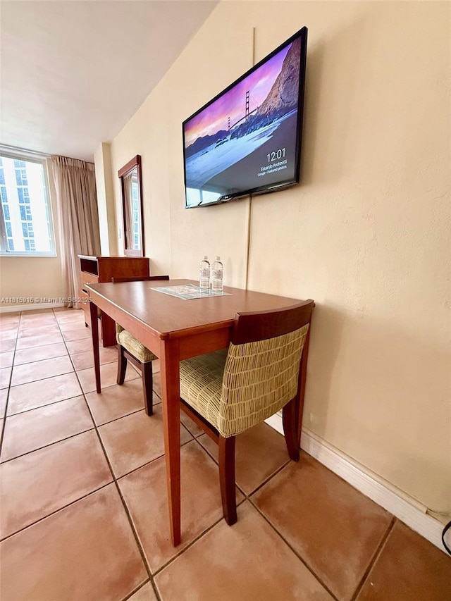 19201 Collins Ave Unit 1019, Sunny Isles Beach, FL 33160 - dining area with light tile patterned flooring and baseboards