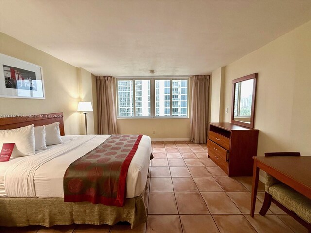 19201 Collins Ave Unit 1019, Sunny Isles Beach, FL 33160 - bedroom featuring light tile patterned flooring and baseboards