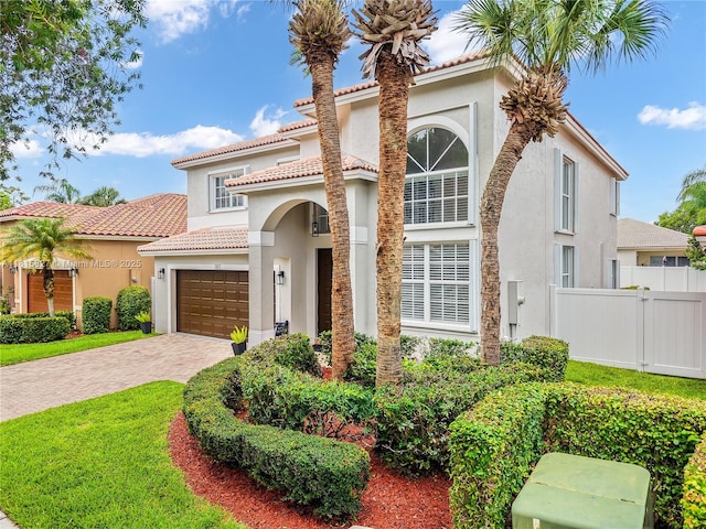 1981 NW 171st Ave, Pembroke Pines, FL 33028 - mediterranean / spanish-style house featuring stucco siding, an attached garage, driveway, and a tile roof