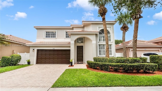 1981 NW 171st Ave, Pembroke Pines, FL 33028 - mediterranean / spanish home with stucco siding, decorative driveway, an attached garage, and a tile roof