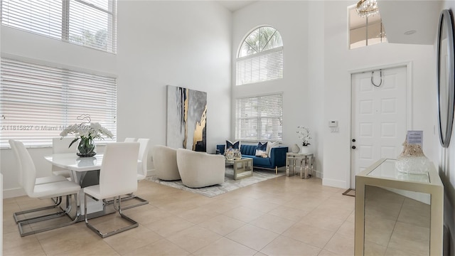 1981 NW 171st Ave, Pembroke Pines, FL 33028 - dining room with a high ceiling, light tile patterned floors, and baseboards