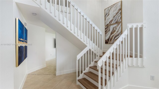 1981 NW 171st Ave, Pembroke Pines, FL 33028 - staircase featuring tile patterned flooring and baseboards