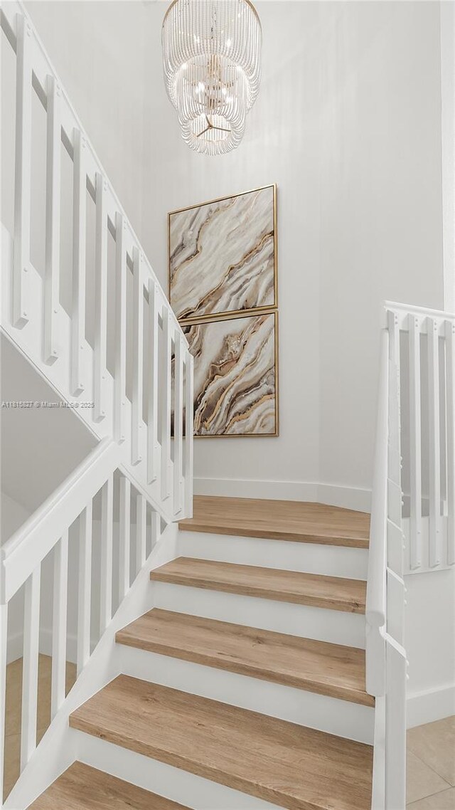 1981 NW 171st Ave, Pembroke Pines, FL 33028 - stairway with a chandelier