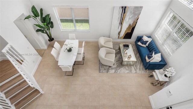 1981 NW 171st Ave, Pembroke Pines, FL 33028 - living room featuring tile patterned flooring, healthy amount of natural light, baseboards, and stairway
