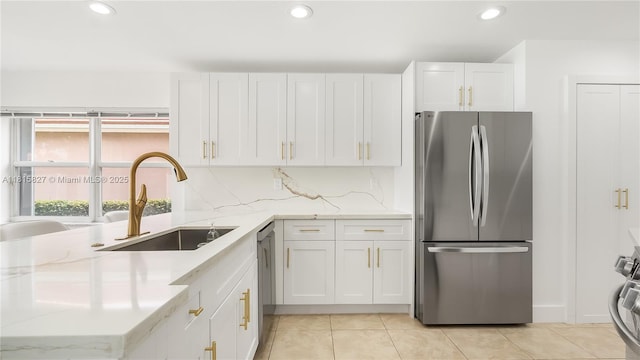 1981 NW 171st Ave, Pembroke Pines, FL 33028 - kitchen with stainless steel appliances, a sink, recessed lighting, white cabinets, and light stone countertops