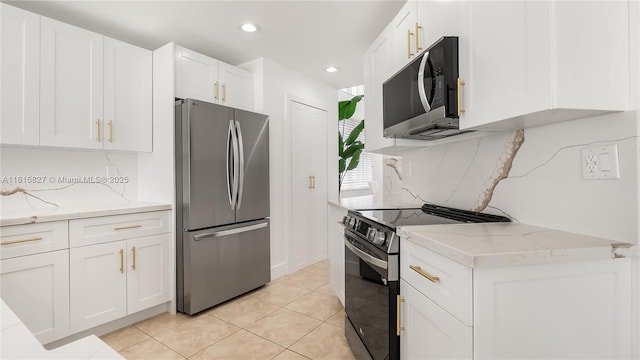 1981 NW 171st Ave, Pembroke Pines, FL 33028 - kitchen with appliances with stainless steel finishes, white cabinetry, backsplash, light stone countertops, and recessed lighting