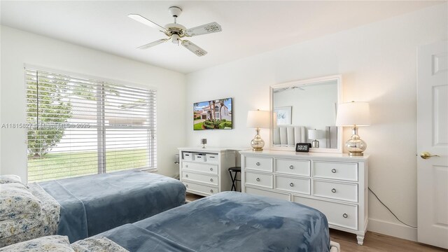 1981 NW 171st Ave, Pembroke Pines, FL 33028 - bedroom with wood finished floors, baseboards, and a ceiling fan