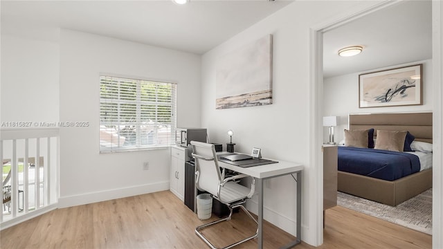 1981 NW 171st Ave, Pembroke Pines, FL 33028 - office area with light wood-style flooring and baseboards