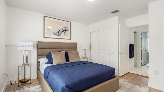 1981 NW 171st Ave, Pembroke Pines, FL 33028 - bedroom featuring light wood-style flooring, baseboards, and a closet