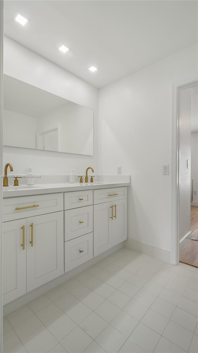 1981 NW 171st Ave, Pembroke Pines, FL 33028 - bathroom with double vanity, baseboards, and tile patterned floors